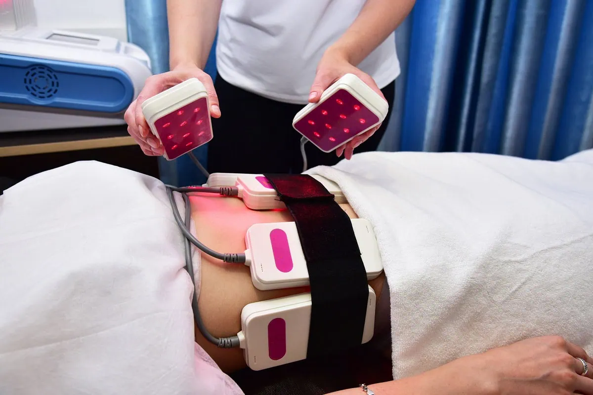 Fat reduction session using laser lipo belts at wellness center.