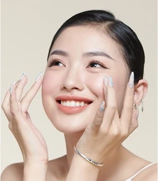 Woman smiling with hands on cheeks in Oklahoma City, OK
