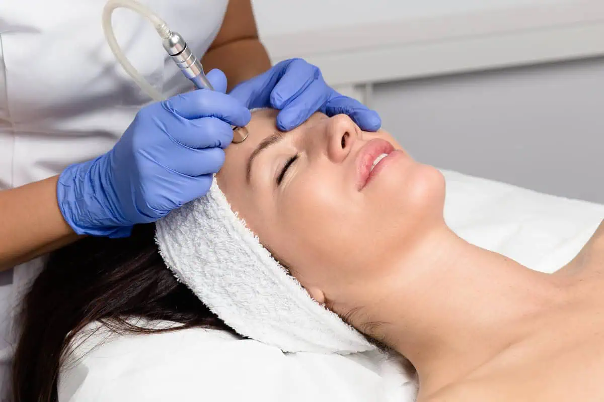 Woman receiving a hydrating oxygen facial treatment for glowing, refreshed skin