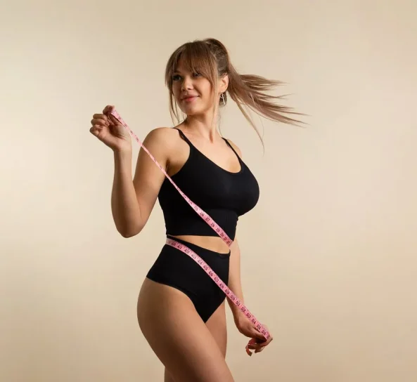 Woman posing with measuring tape in Oklahoma City, OK