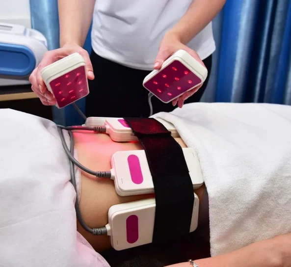Fat reduction session using laser lipo belts at wellness center.