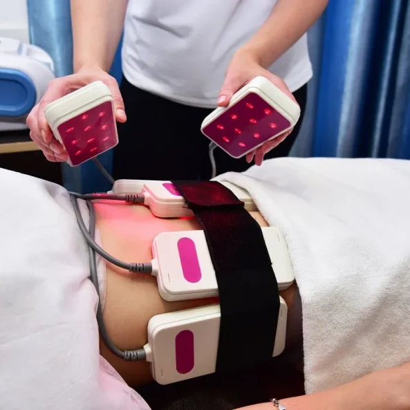 Fat reduction session using laser lipo belts at wellness center.