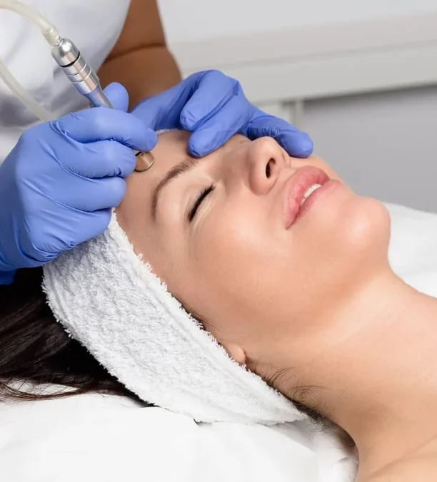 Skincare expert performing facial injection procedure.