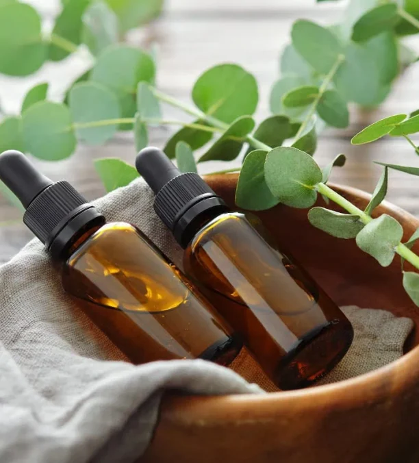 Natural skincare products set up on a spa towel.